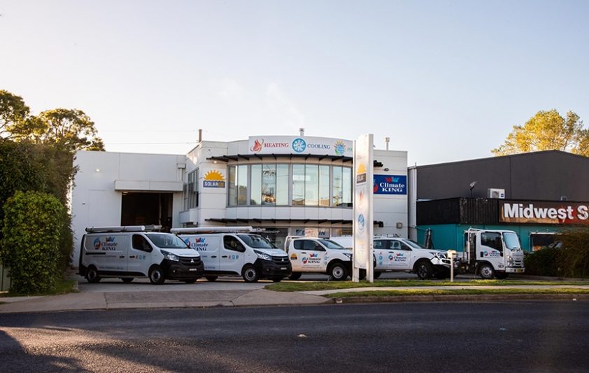 White Vans in Front of a Shop — Heating & Cooling in Central West NSW