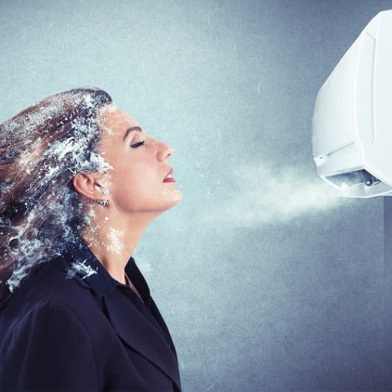 Woman With Icy Hair in Front of the Aircon — Heating & Cooling in Central West NSW