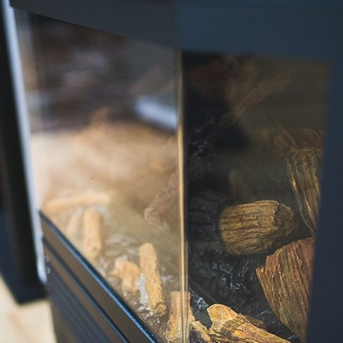 Furnace with Wood and a Glass Cover — Heating & Cooling in Cowra, NSW